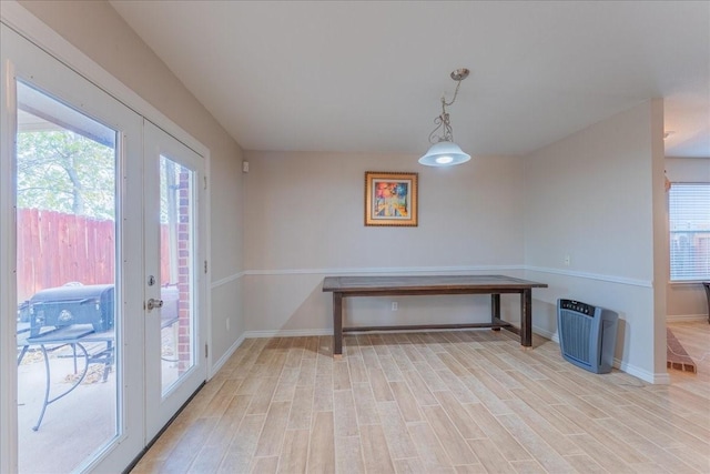 10128 High Eagle Trl, Fort Worth, TX 76108 - dining room with french doors, light wood finished floors, and baseboards