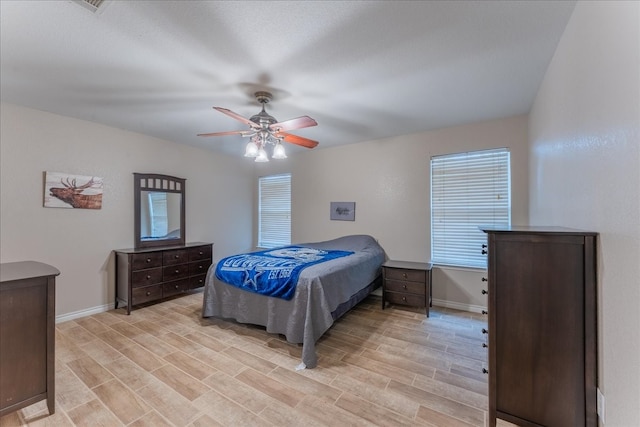 bedroom featuring light hardwood / wood-style floors and ceiling fan