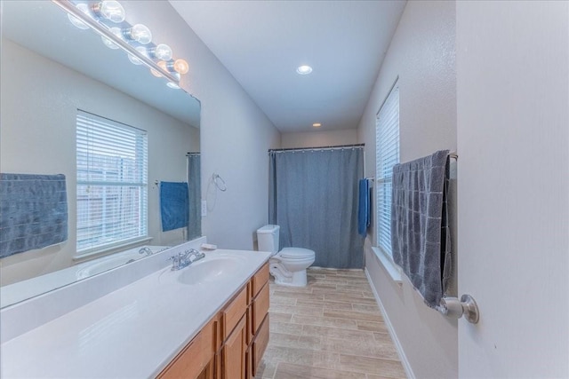 10128 High Eagle Trl, Fort Worth, TX 76108 - bathroom featuring toilet, vanity, wood finished floors, shower / bath combo, and recessed lighting