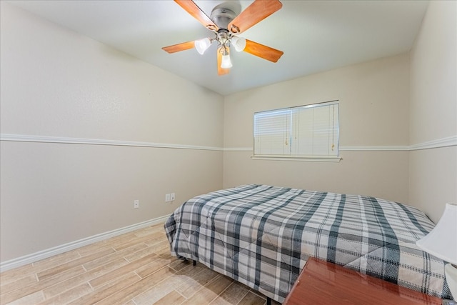 bedroom with ceiling fan and light wood-type flooring