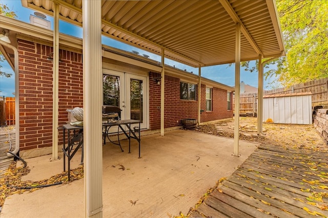 view of patio featuring a storage unit