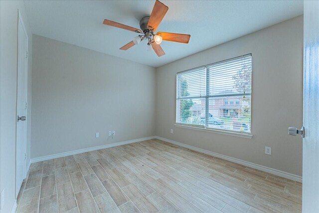 empty room featuring light hardwood / wood-style flooring and ceiling fan