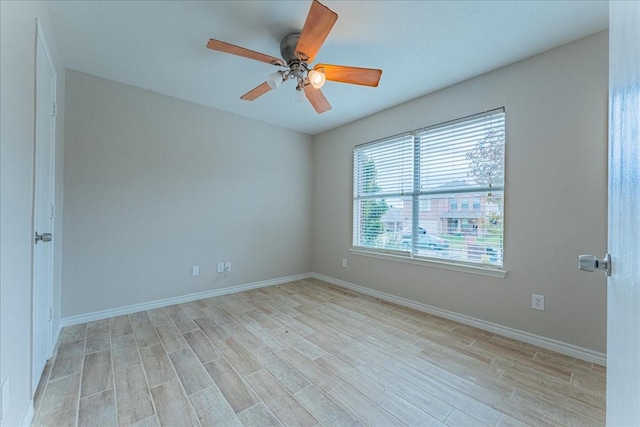 spare room with ceiling fan and light hardwood / wood-style flooring