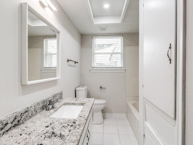 bathroom with tile patterned flooring, vanity, and toilet