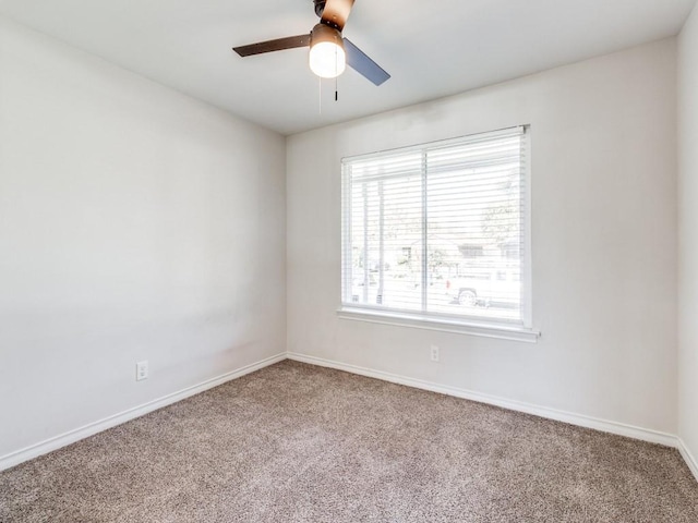 carpeted empty room with plenty of natural light and ceiling fan