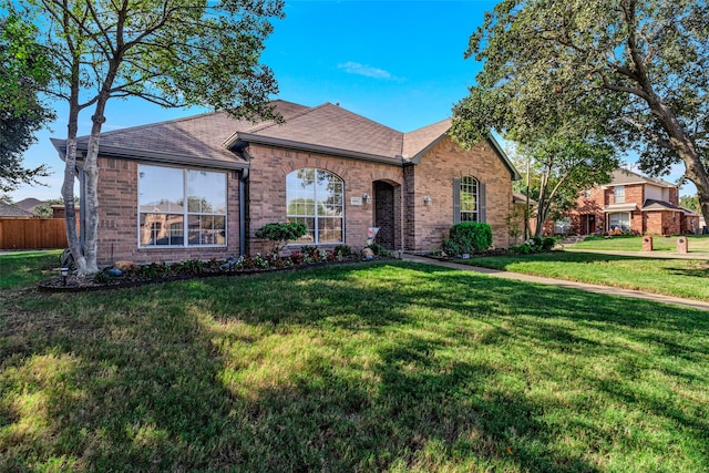 ranch-style house with a front lawn