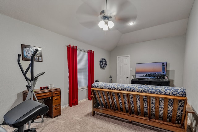 bedroom featuring ceiling fan, light colored carpet, and vaulted ceiling