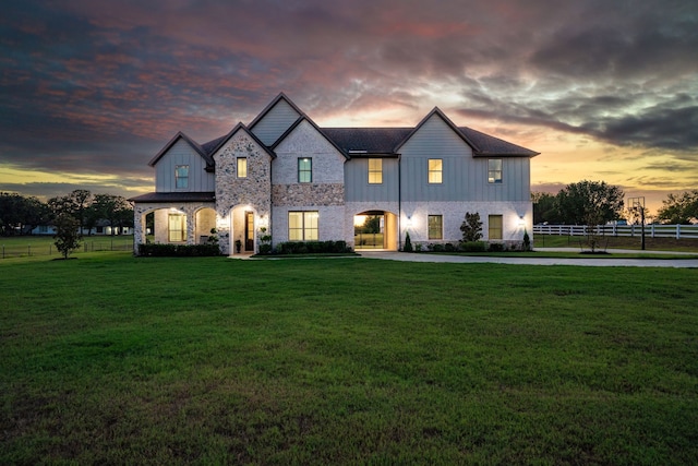 view of front of home with a lawn