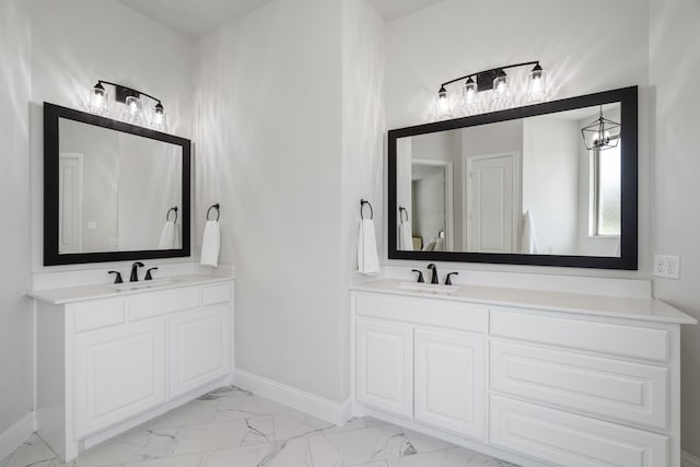 bathroom with vanity and a notable chandelier