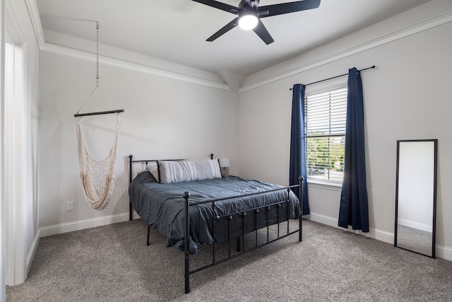 carpeted bedroom with ceiling fan and crown molding