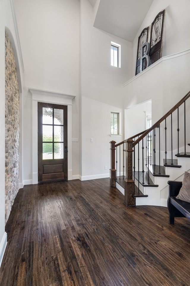 entryway featuring a high ceiling and hardwood / wood-style flooring