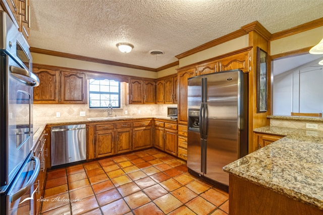 kitchen featuring decorative backsplash, appliances with stainless steel finishes, crown molding, and sink