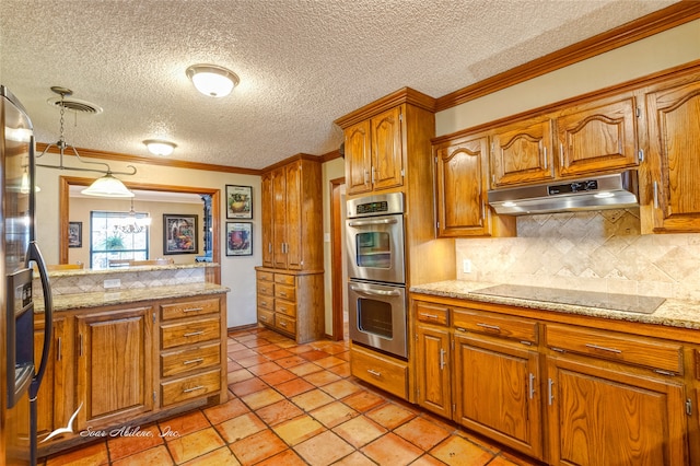 kitchen with hanging light fixtures, ornamental molding, a textured ceiling, appliances with stainless steel finishes, and tasteful backsplash