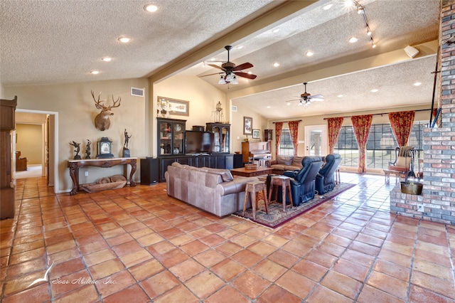 living room featuring vaulted ceiling with beams, ceiling fan, and a textured ceiling