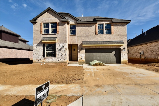 view of front of property featuring a garage