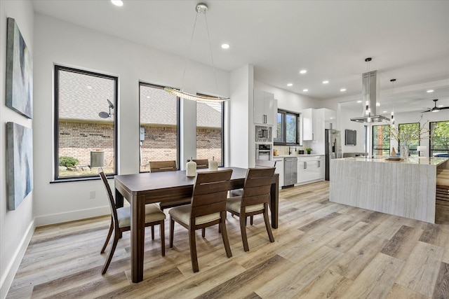 dining area with light wood-type flooring