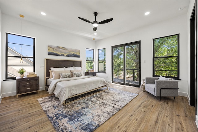 bedroom with light hardwood / wood-style flooring, access to outside, and ceiling fan