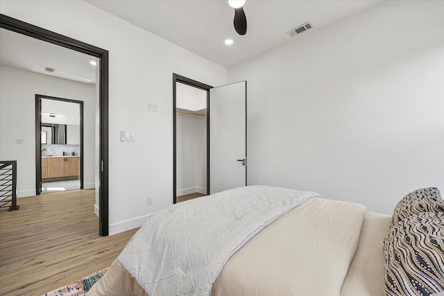 bedroom with ceiling fan and light hardwood / wood-style flooring