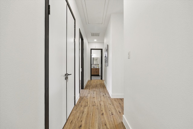 hallway featuring light wood-type flooring