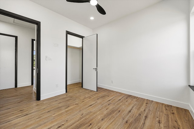 unfurnished bedroom featuring light hardwood / wood-style flooring and ceiling fan