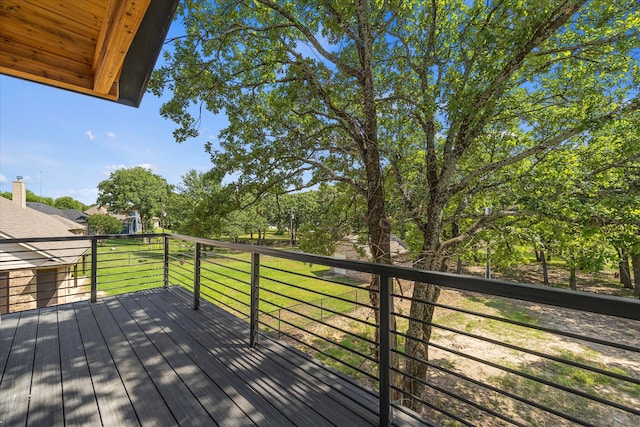 wooden deck with a lawn