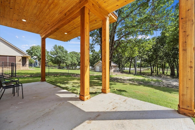 view of patio / terrace with a shed