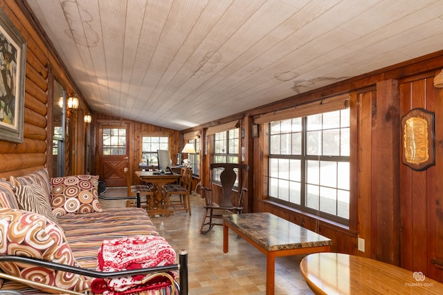 living room featuring vaulted ceiling, rustic walls, wood ceiling, and wood walls