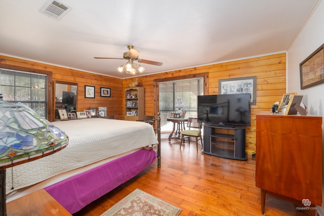 bedroom featuring crown molding and hardwood / wood-style floors