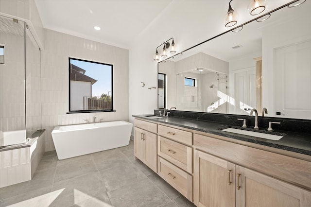 bathroom with tile patterned flooring, vanity, separate shower and tub, and ornamental molding