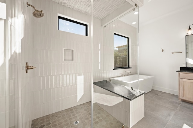 bathroom featuring vanity, shower with separate bathtub, and tile patterned flooring