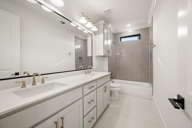 full bathroom with tiled shower / bath, vanity, and toilet