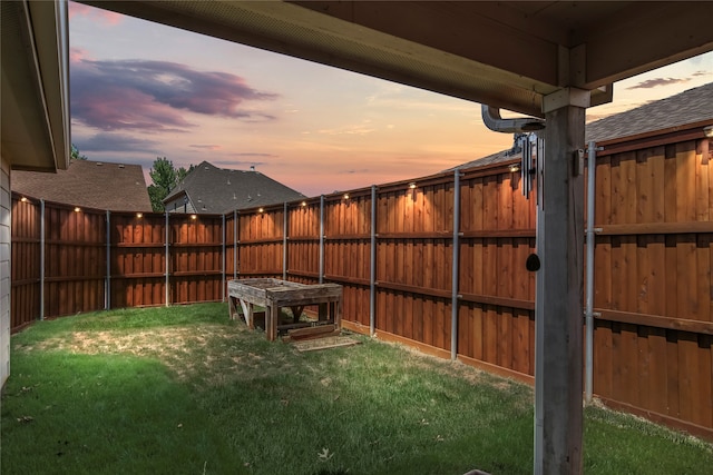 view of yard at dusk