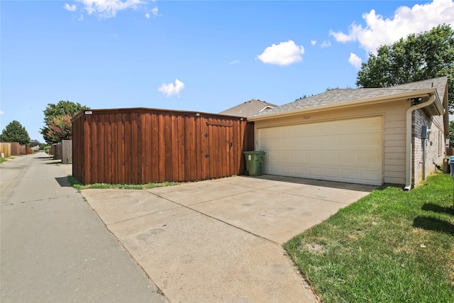 view of side of property featuring a garage