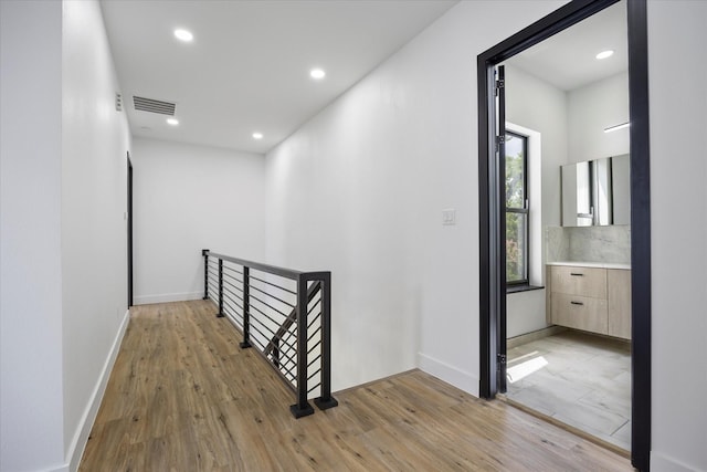 hallway with light wood-type flooring