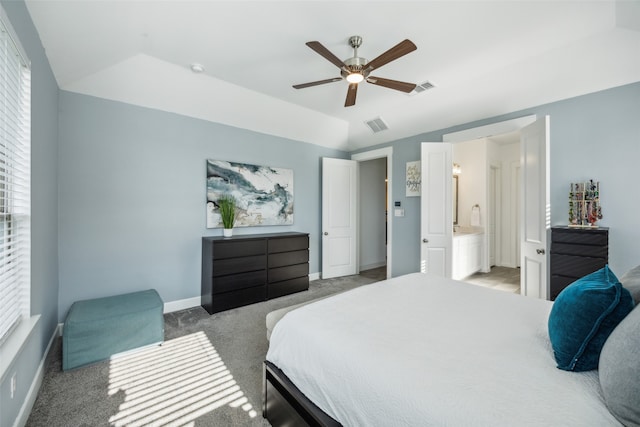 carpeted bedroom featuring ensuite bathroom, ceiling fan, and lofted ceiling