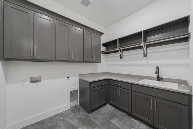 laundry room with washer hookup, hookup for an electric dryer, cabinets, and sink