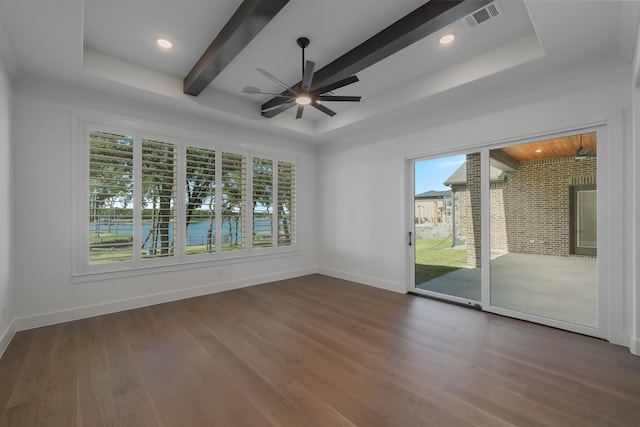 unfurnished room featuring beam ceiling, ceiling fan, and dark hardwood / wood-style floors