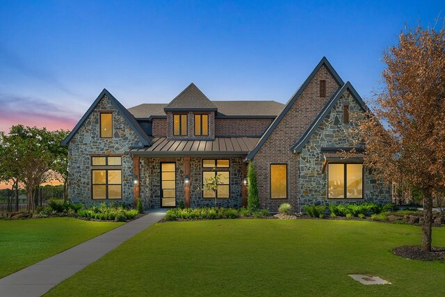 entrance foyer with a barn door, dark hardwood / wood-style flooring, and an inviting chandelier