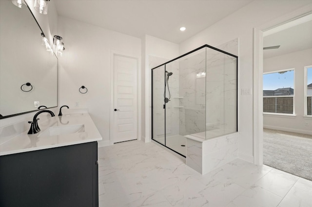 bathroom featuring vanity and a shower with shower door