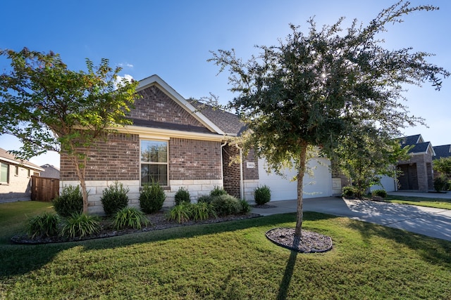 view of front of house featuring a garage and a front lawn