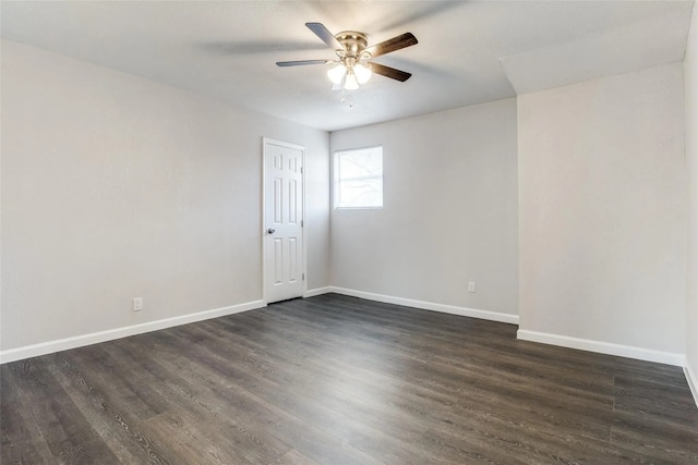 empty room featuring ceiling fan and dark hardwood / wood-style floors