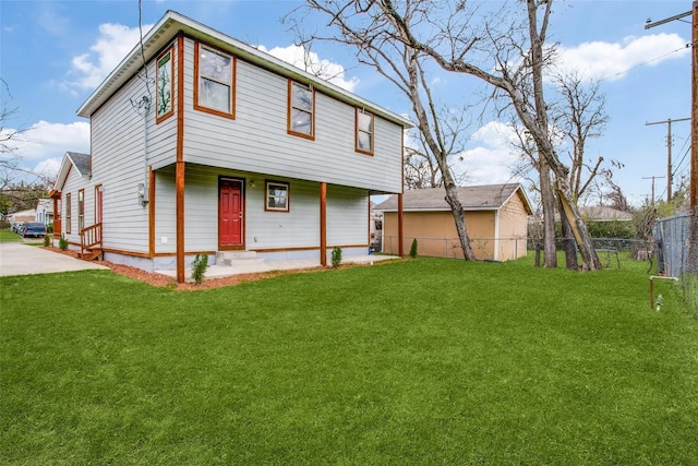 rear view of property with a lawn