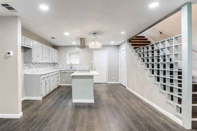 2438 Lea Crest Dr, Dallas, TX 75216 - kitchen with light countertops, dark wood finished floors, tasteful backsplash, baseboards, and recessed lighting