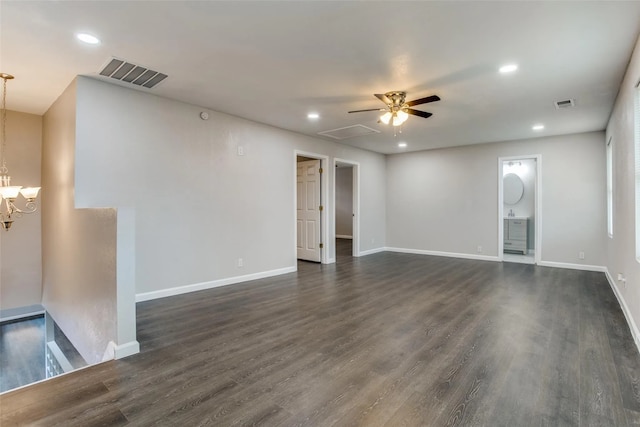 unfurnished room with dark hardwood / wood-style flooring and ceiling fan with notable chandelier