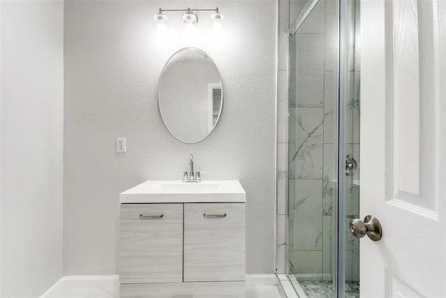 bathroom with vanity and a shower with shower door