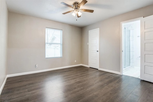 empty room with ceiling fan and dark wood-type flooring