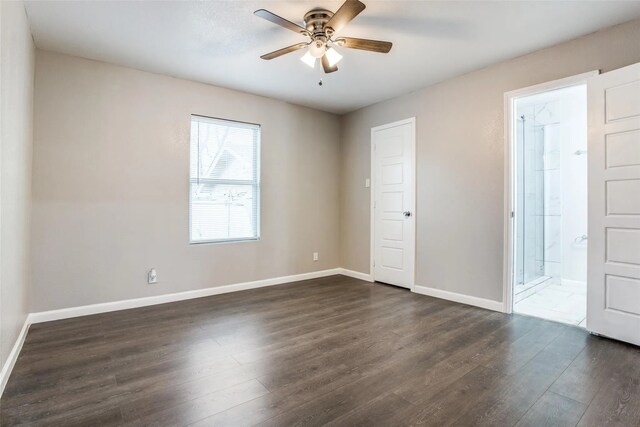 2438 Lea Crest Dr, Dallas, TX 75216 - unfurnished room featuring dark wood-style flooring, a ceiling fan, and baseboards