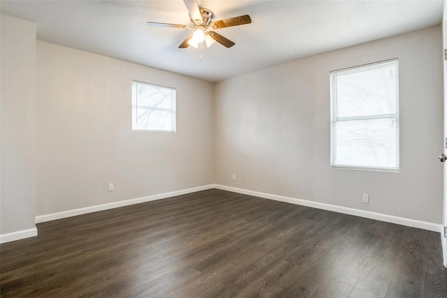 unfurnished room with ceiling fan and dark hardwood / wood-style flooring