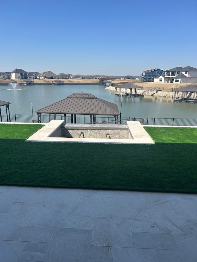 view of patio with a water view