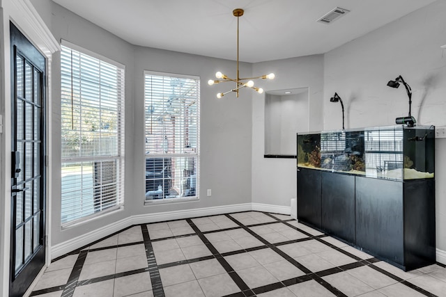 unfurnished dining area with an inviting chandelier